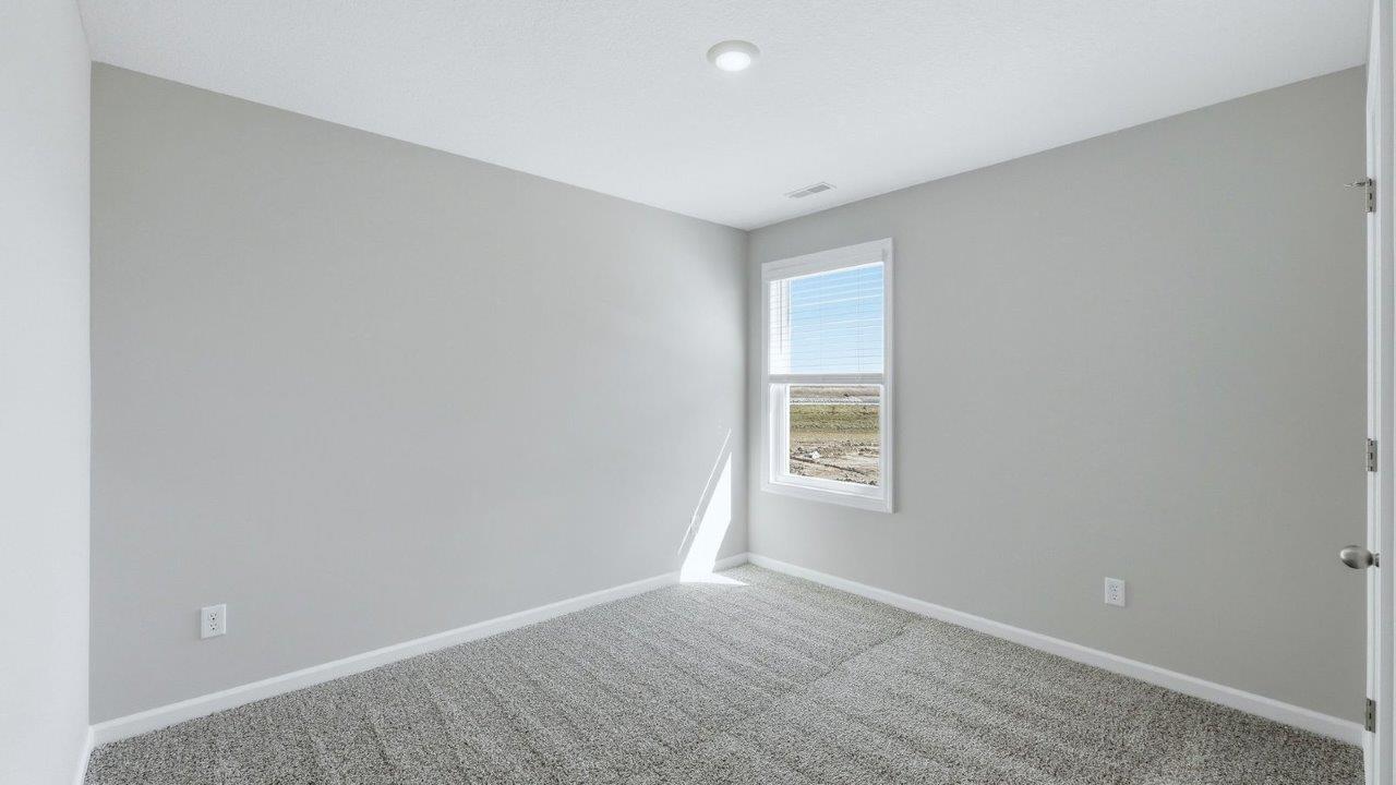 bedroom 4 with beige carpet, 1 windows, and popular grey walls