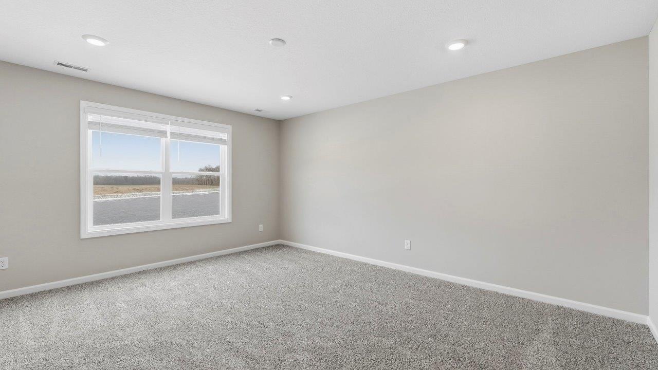 primary bedroom with carpet