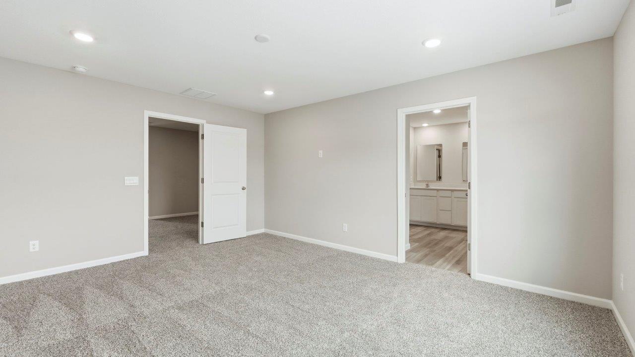 primary bedroom with carpet