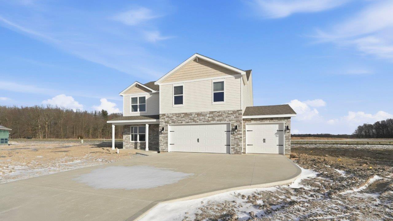 parlor bluffs henley exterior with 3 car garage