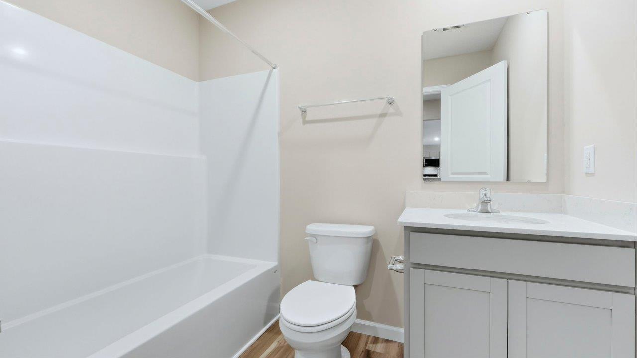 full bath with vanity sink and tub shower