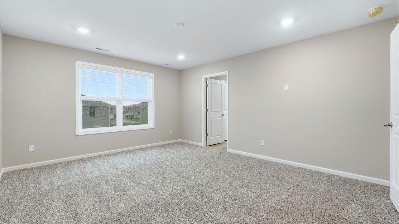 primary bedroom with ensuite bath and closet