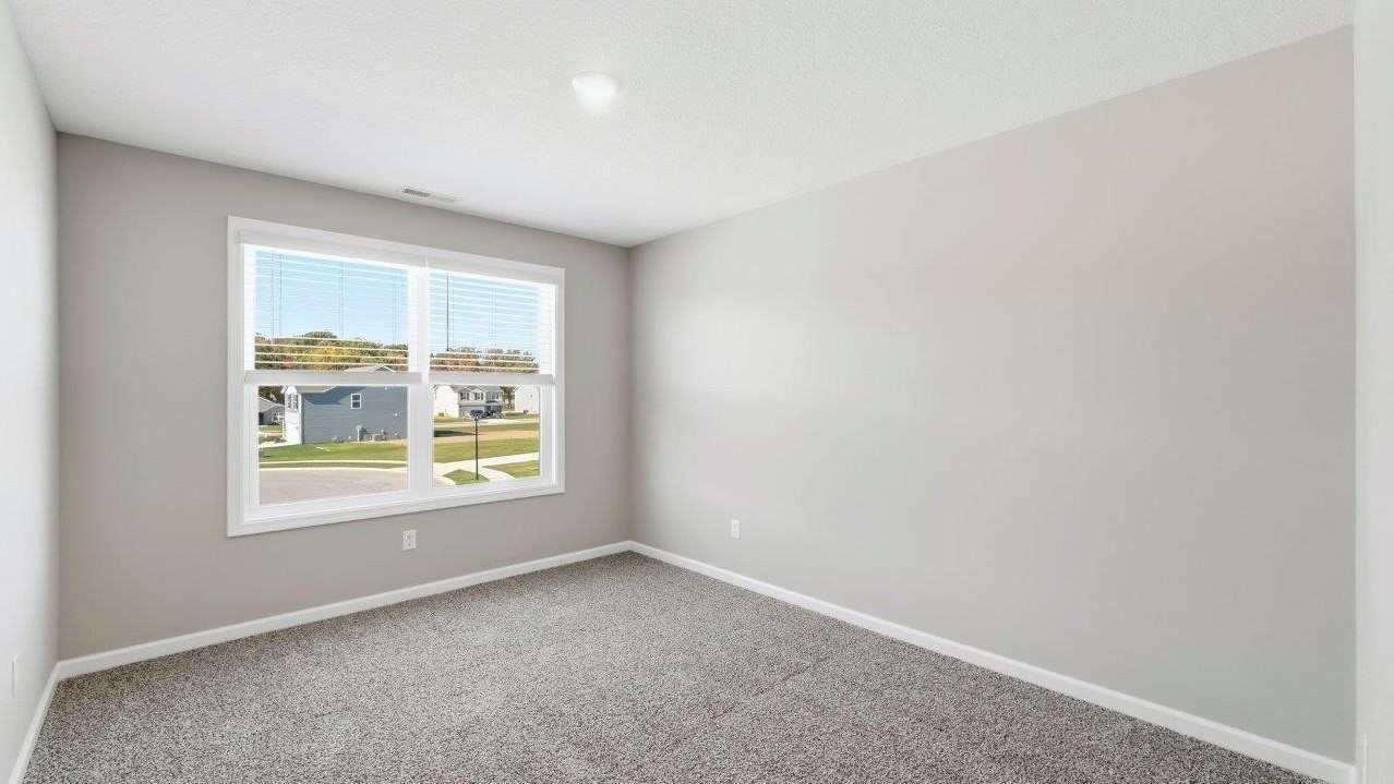 bed 3 with 2 windows, carpet, and closet