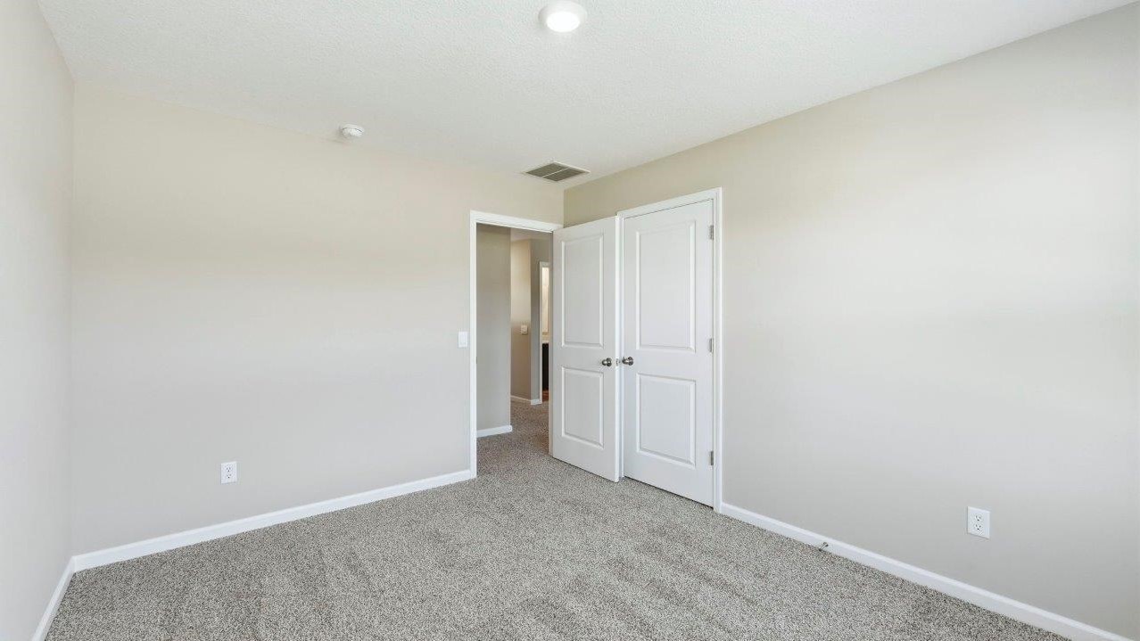 bed 4 with 2 windows, carpet, and closet