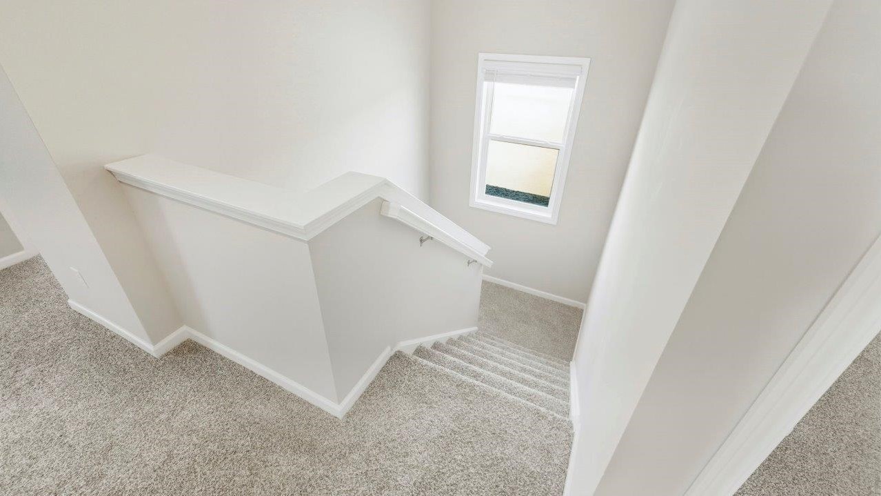 half turn staircase leading to second floor loft