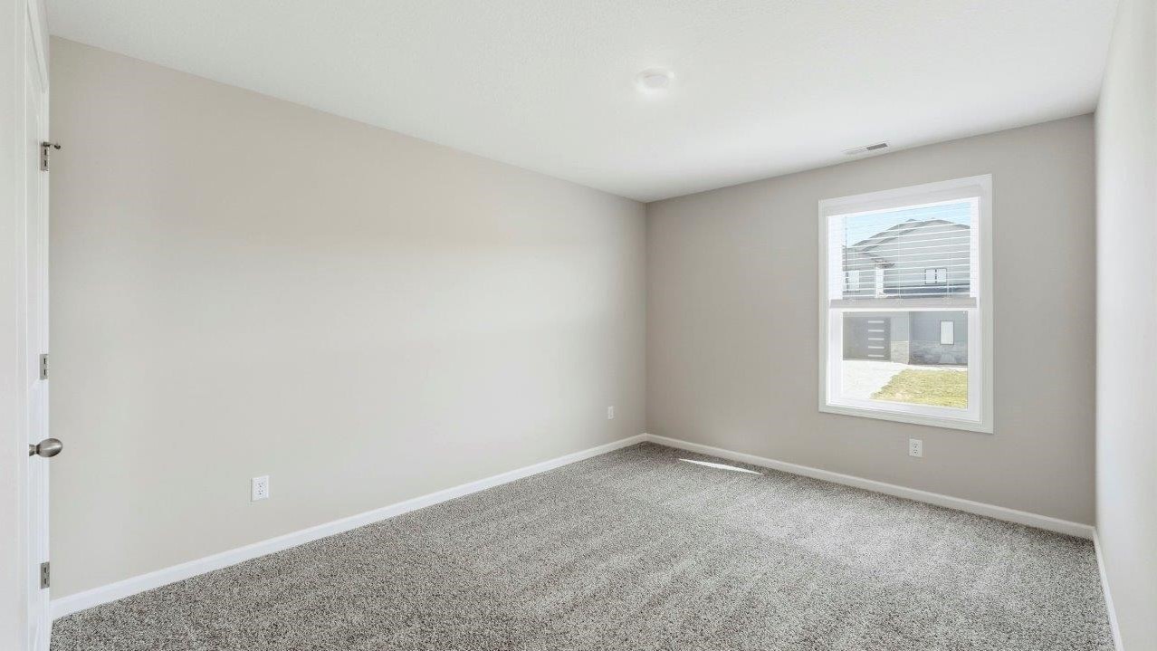 bedroom 2 with carpet, 1 window, and closet