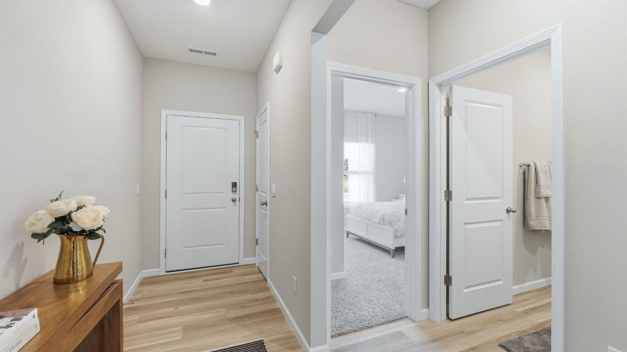 Sierra ridge chatham model front hallway and door with lvp flooring