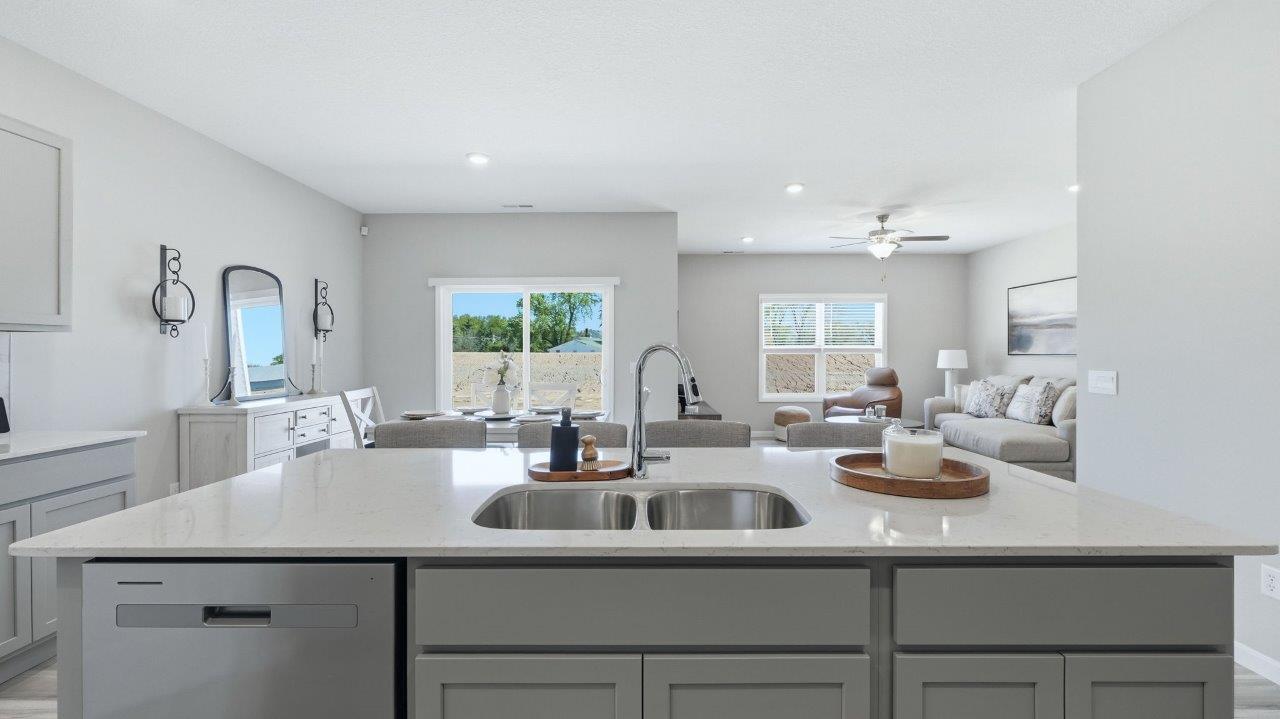 sierra ridge chatham kitchen gray cabinets, quartz counters, stainless steel appliances, corner pantry, and spacious island with bar seating