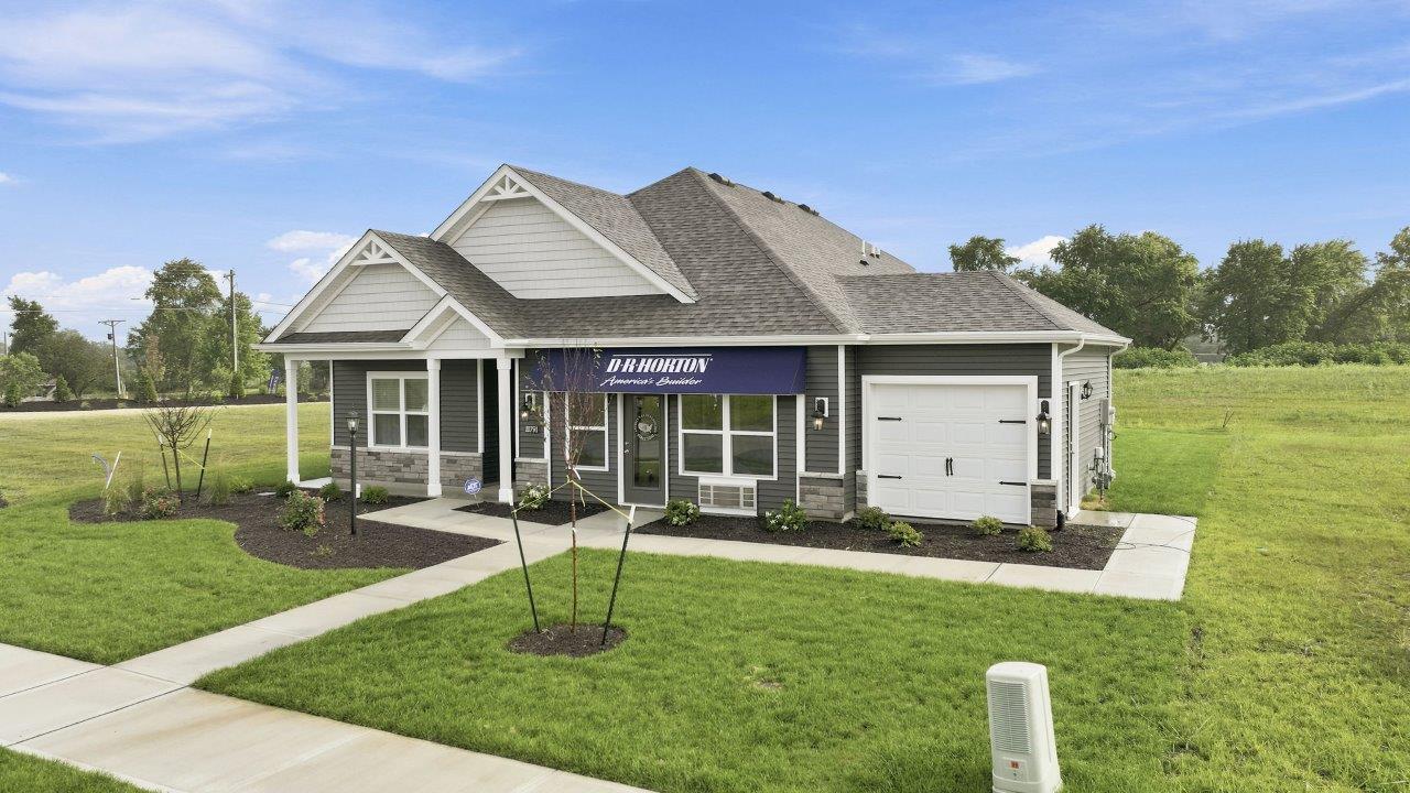 sierra ridge chatham model home exterior with ironstone vinyl siding and moonlit trail stone with sterling shake