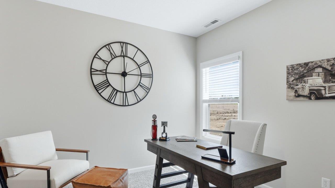 sierra ridge chatham bedroom 2 furnished as office space with carpet flooring