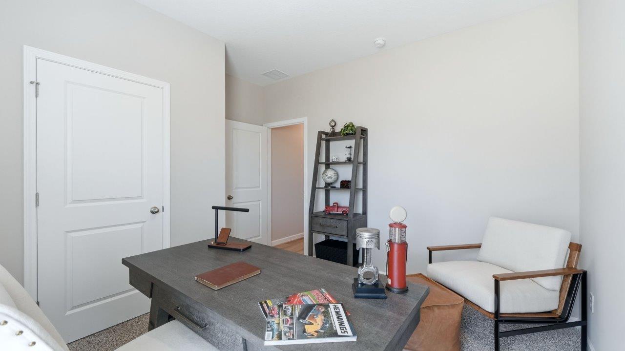 sierra ridge chatham bedroom 2 furnished as office space with carpet flooring