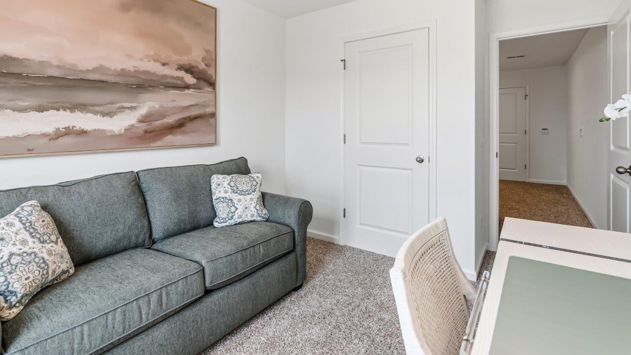 Whispering Pines Pattison Model - bedroom 2 with single window, beige carpet flooring, and white walls furnished as office