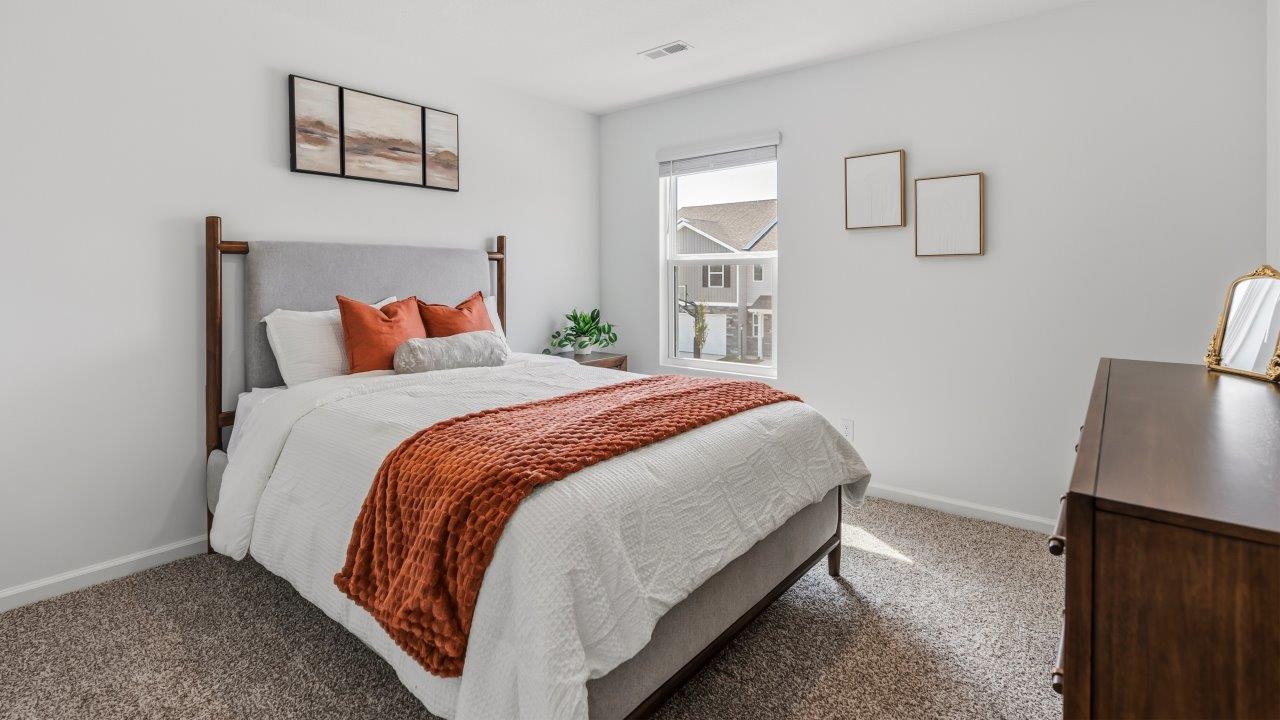 Whispering Pines Pattison Model - bedroom 4 with 1 single, beige carpet flooring, white walls, and ensuite closet furnished as bedrooom