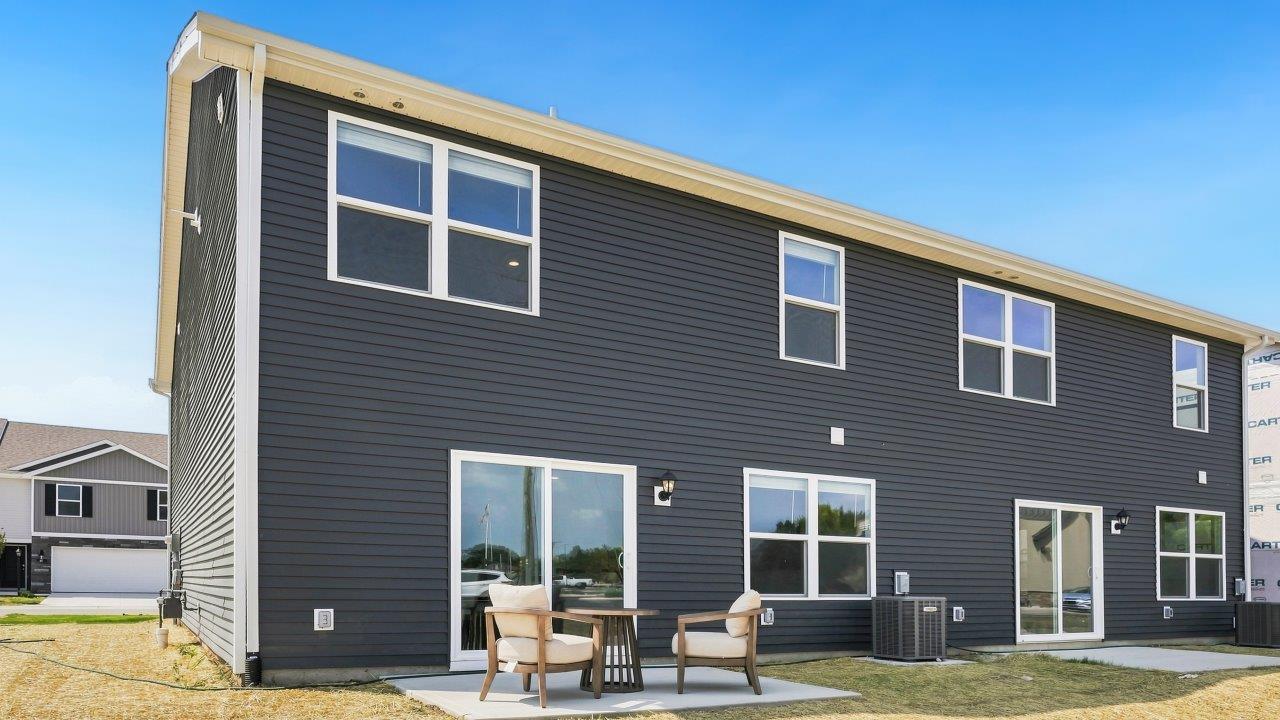 Whispering Pines Pattison Model - rear exterior with concrete patio