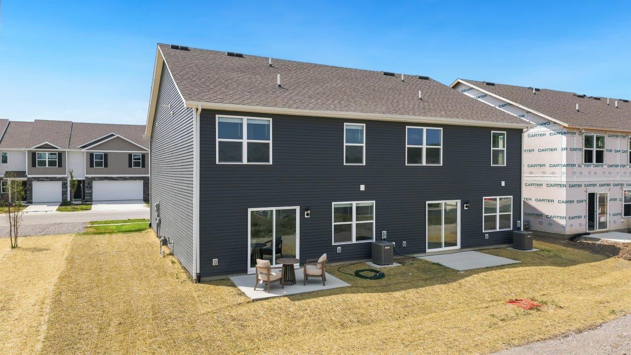 Whispering Pines Pattison Model - rear exterior with concrete patio