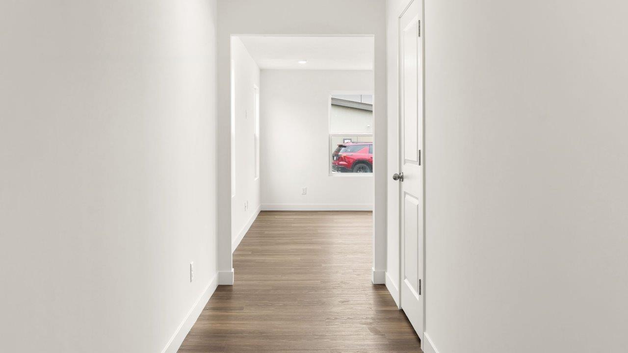 whispering pines portsmouth - foyer with lvp flooring leading to open layout