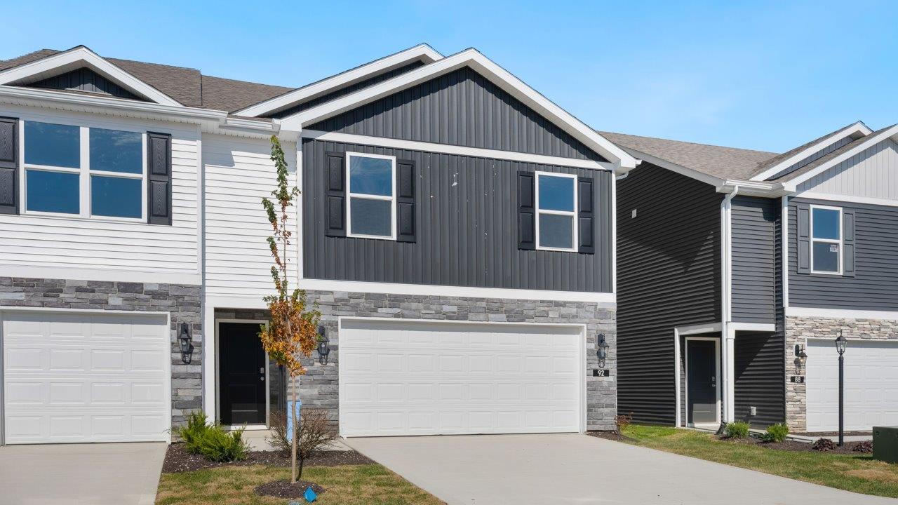 Whispering Pines portsmouth exterior with 2 car garage, covered front door, sodded yard