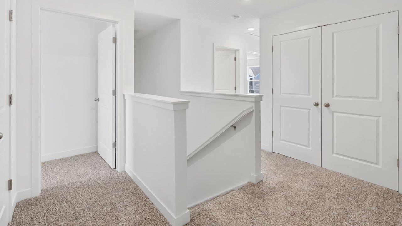 whispering pines portsmouth second floor staircase landing with elk beige carpet flooring