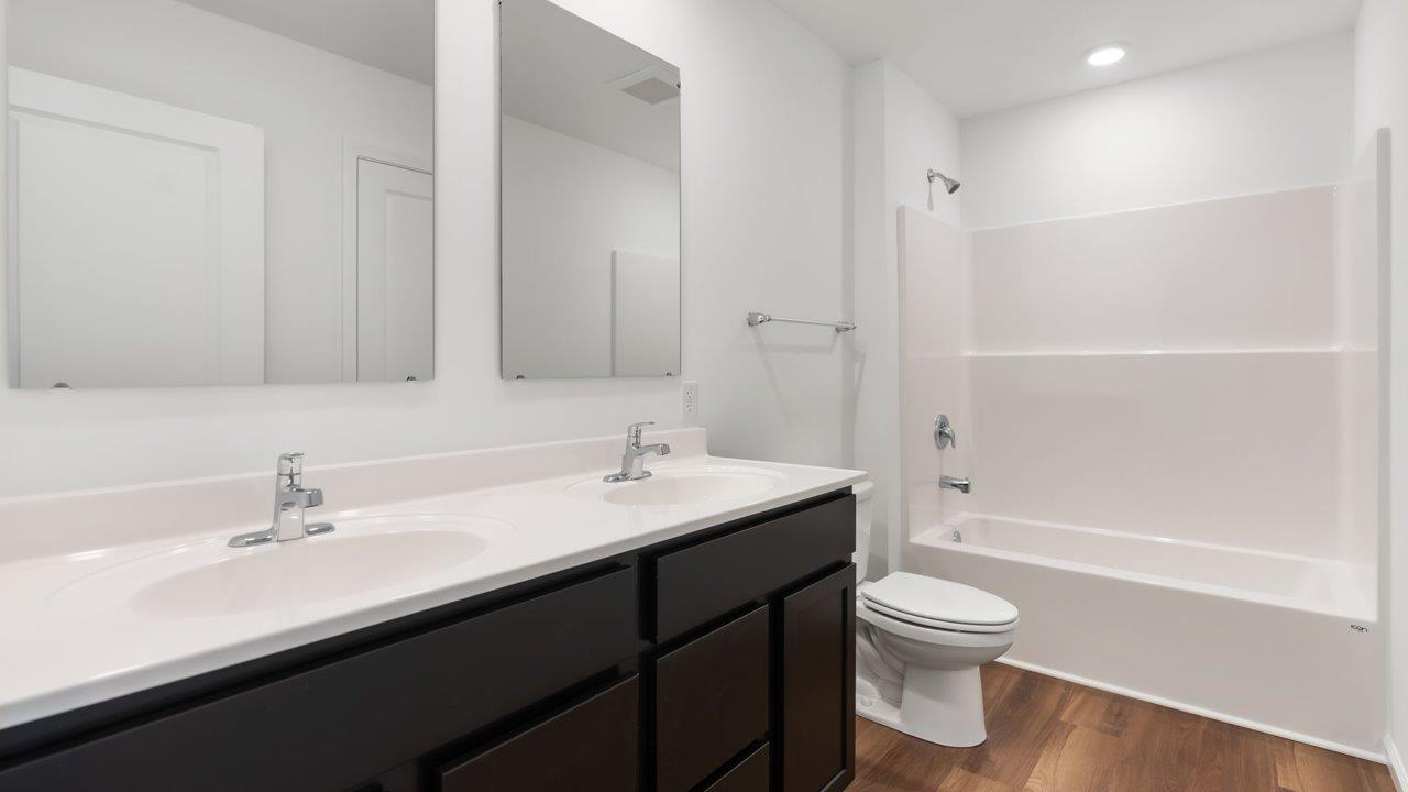 whispering pines portsmouth full bathroom with tub shower and dual sink vanity