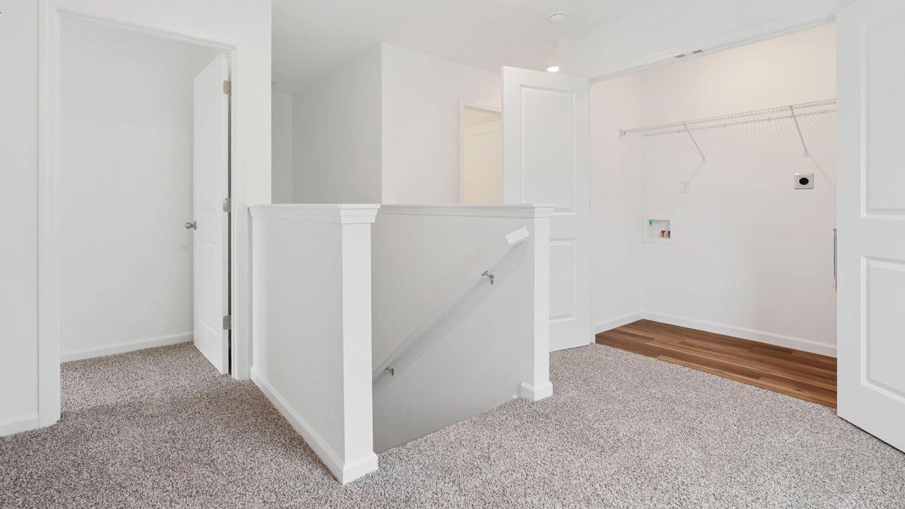 second floor landing with laundry room