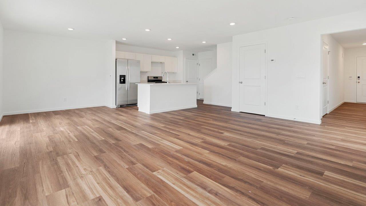 foyer leading into open concept first floor living room, casual dining room, and kitchen