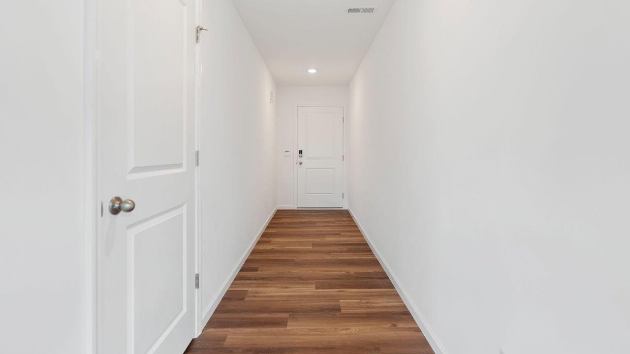 front door and foyer with lvp flooring