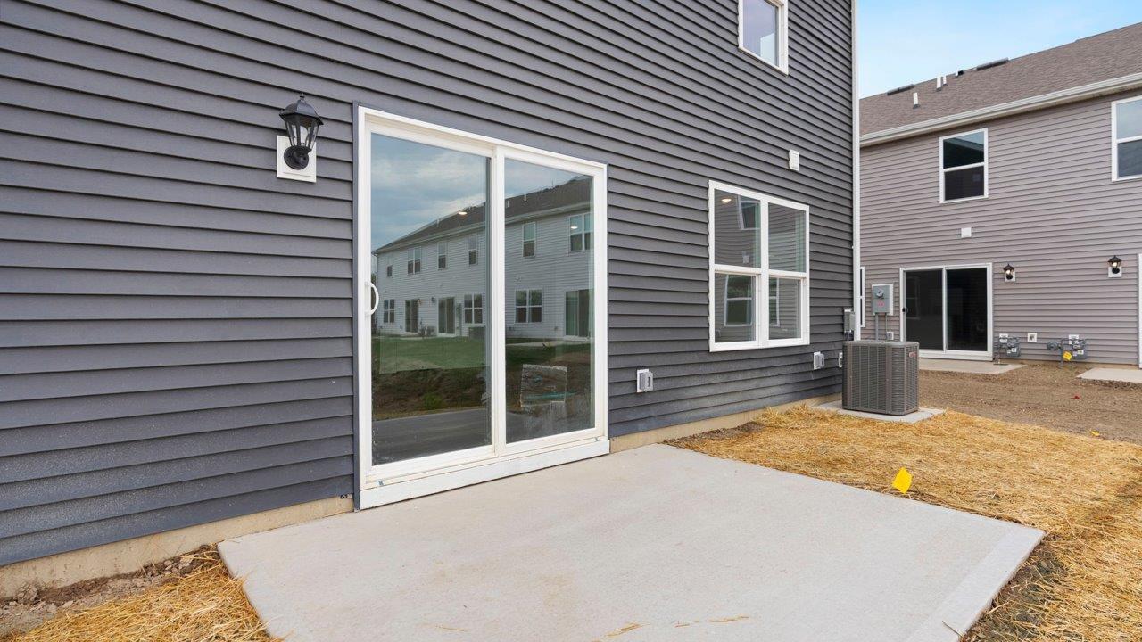 rear exterior with concrete patio