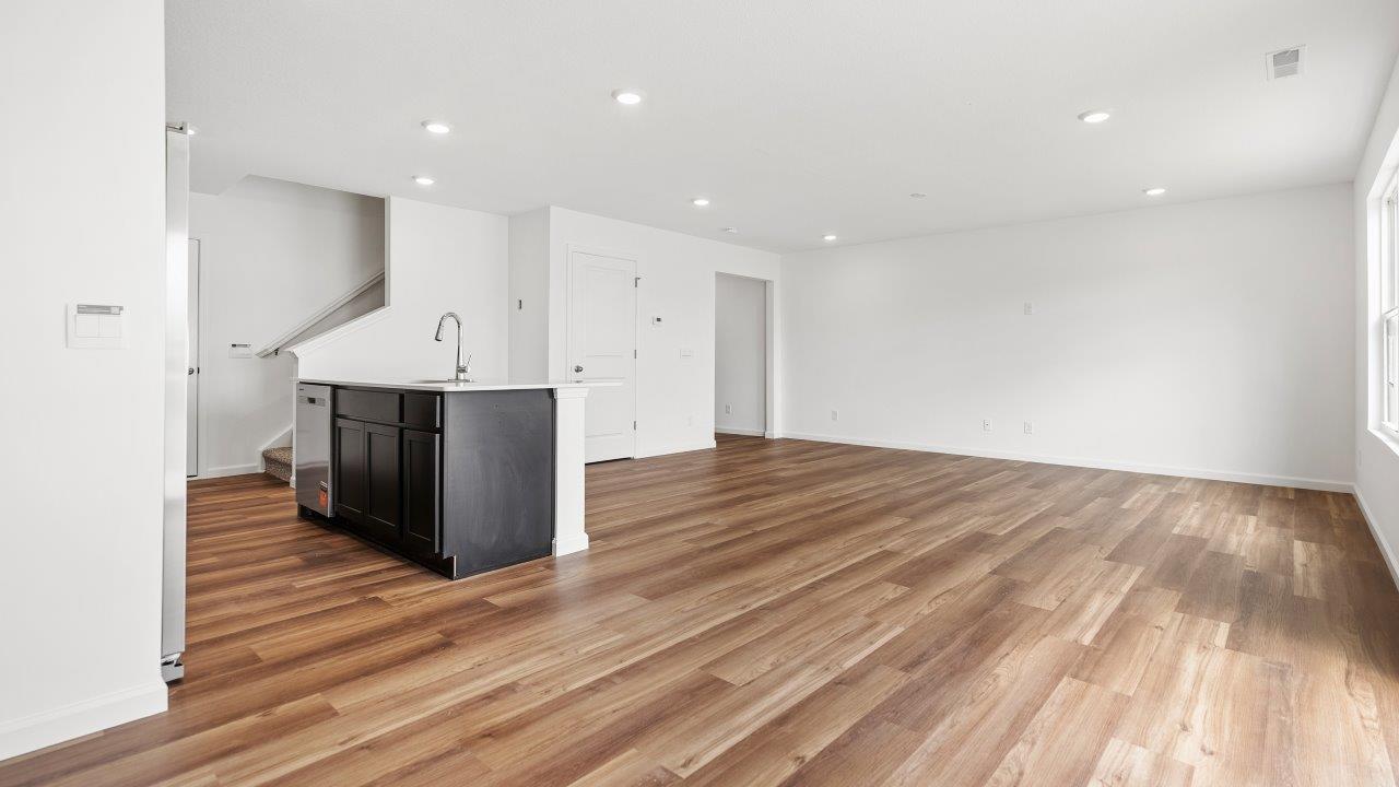 casual dining space with luxury vinyl plank flooring with sliding glass door
