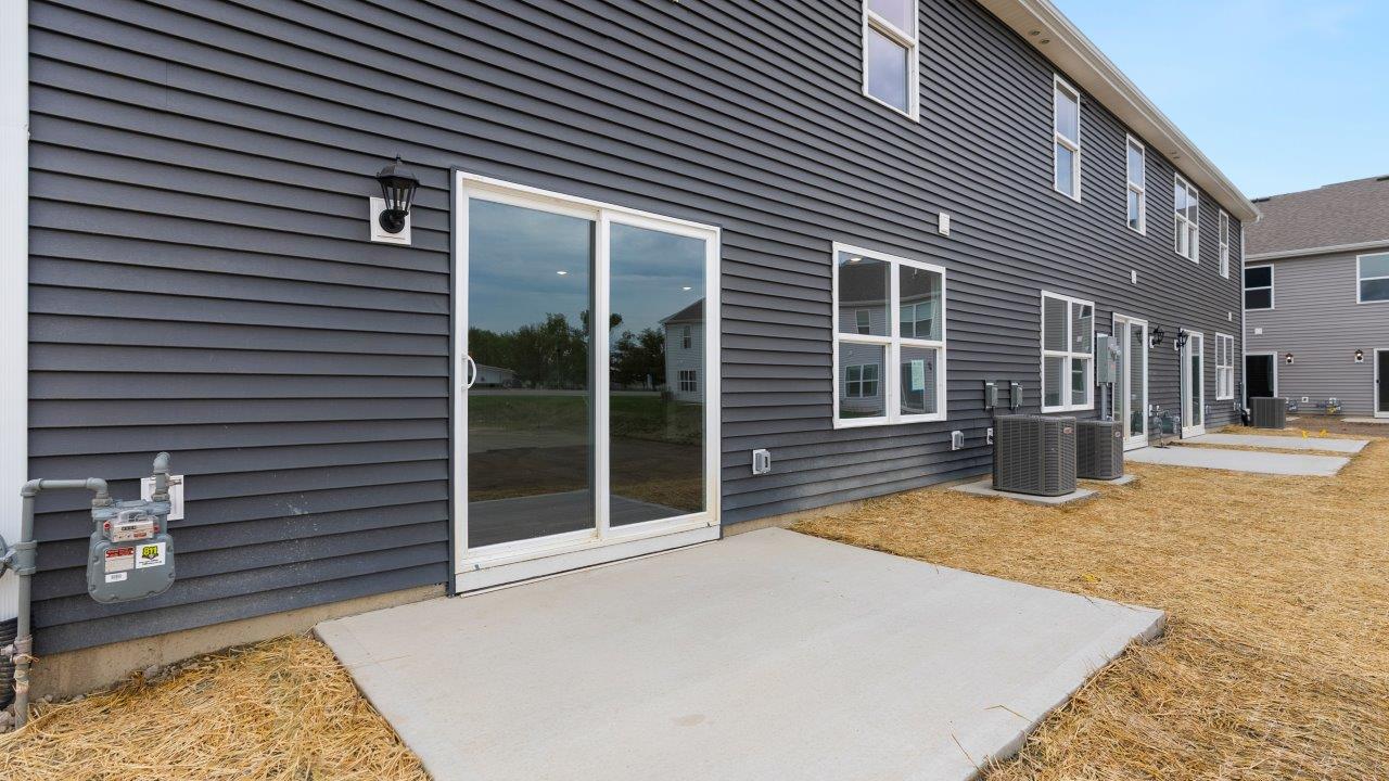 rear exterior with concrete patio