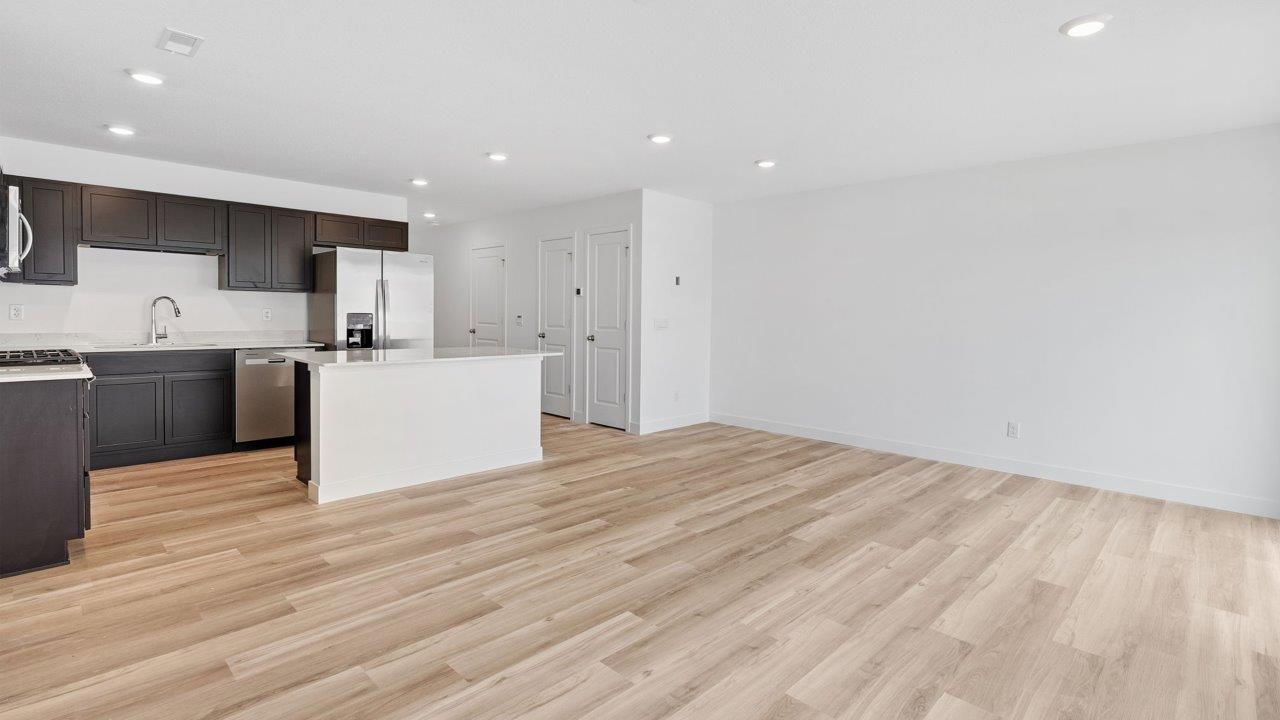 whispering pines pearson - open layout living room with mohawk lvp flooring