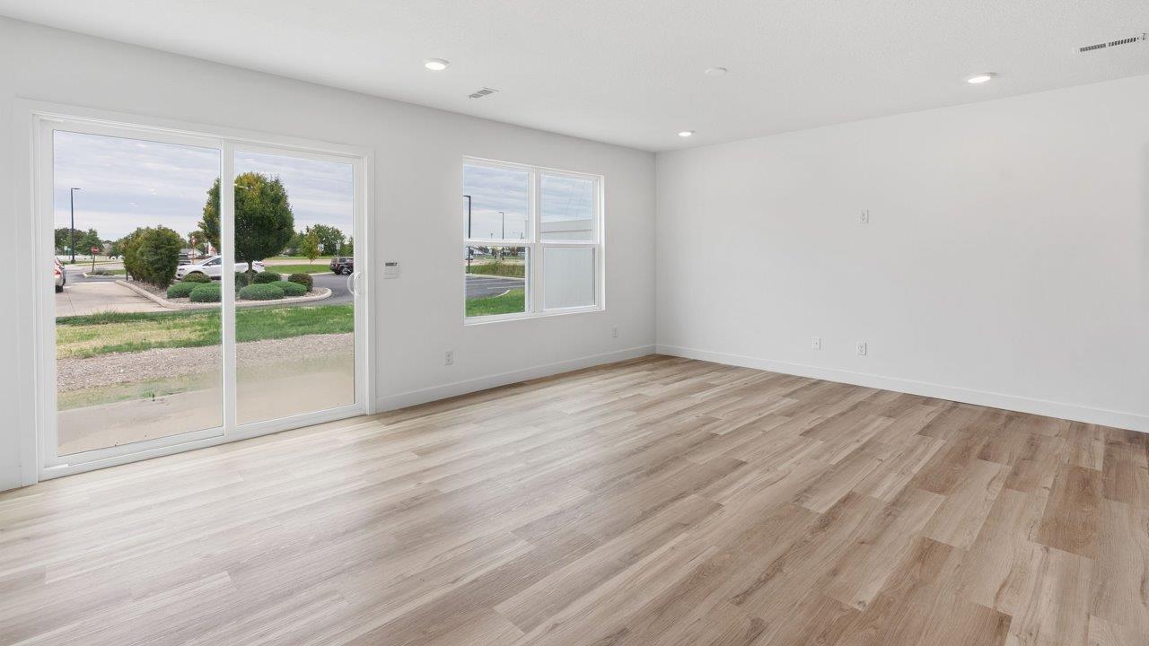 whispering pines pearson - casual dining room with lvp flooring and sliding glass door to backyard