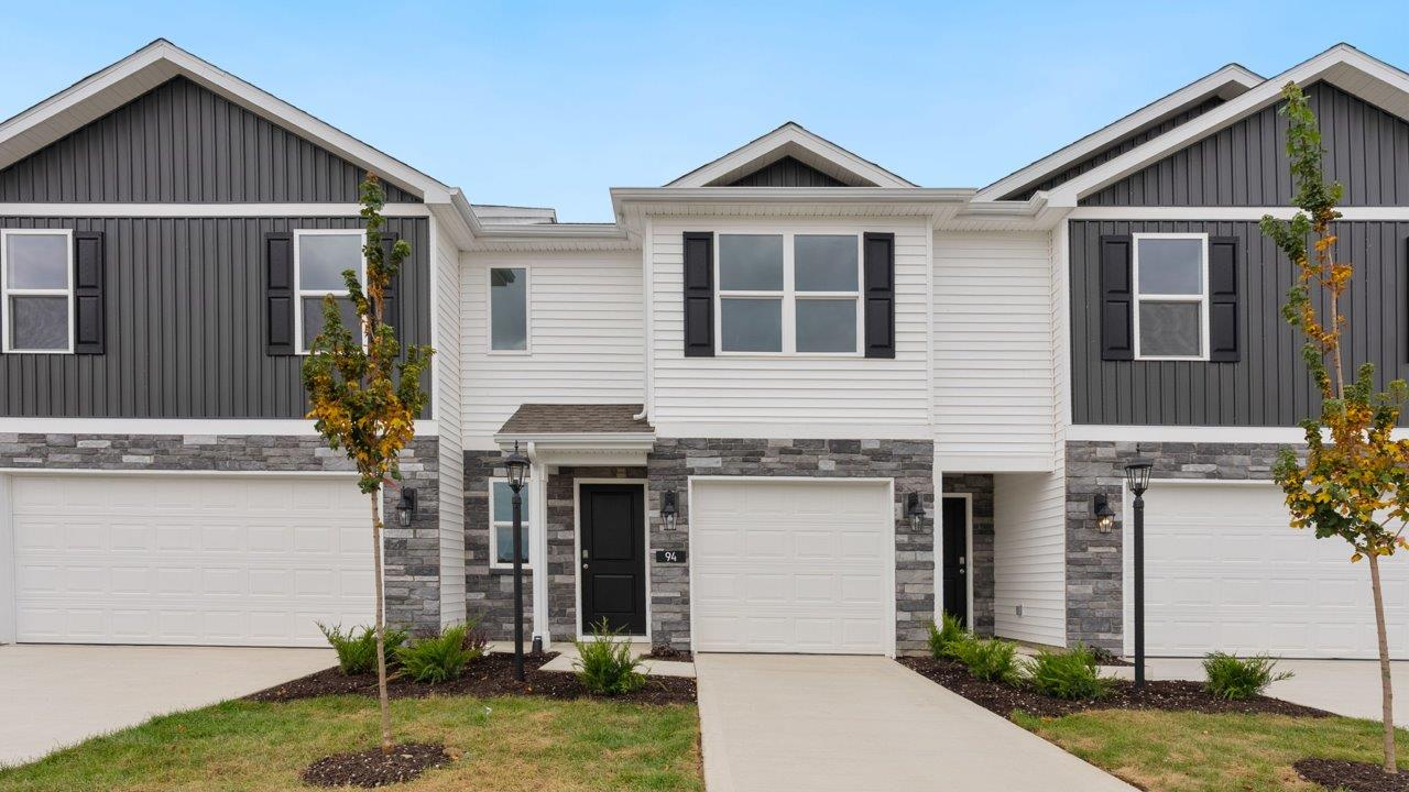 whispering pines pearson exterior with single car garage, sodded yard, and landscaping