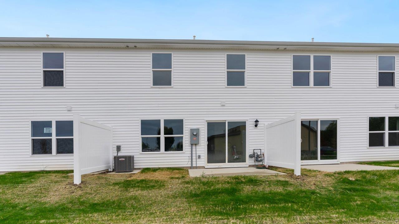 whispering pines pearson rear exterior with concrete patio