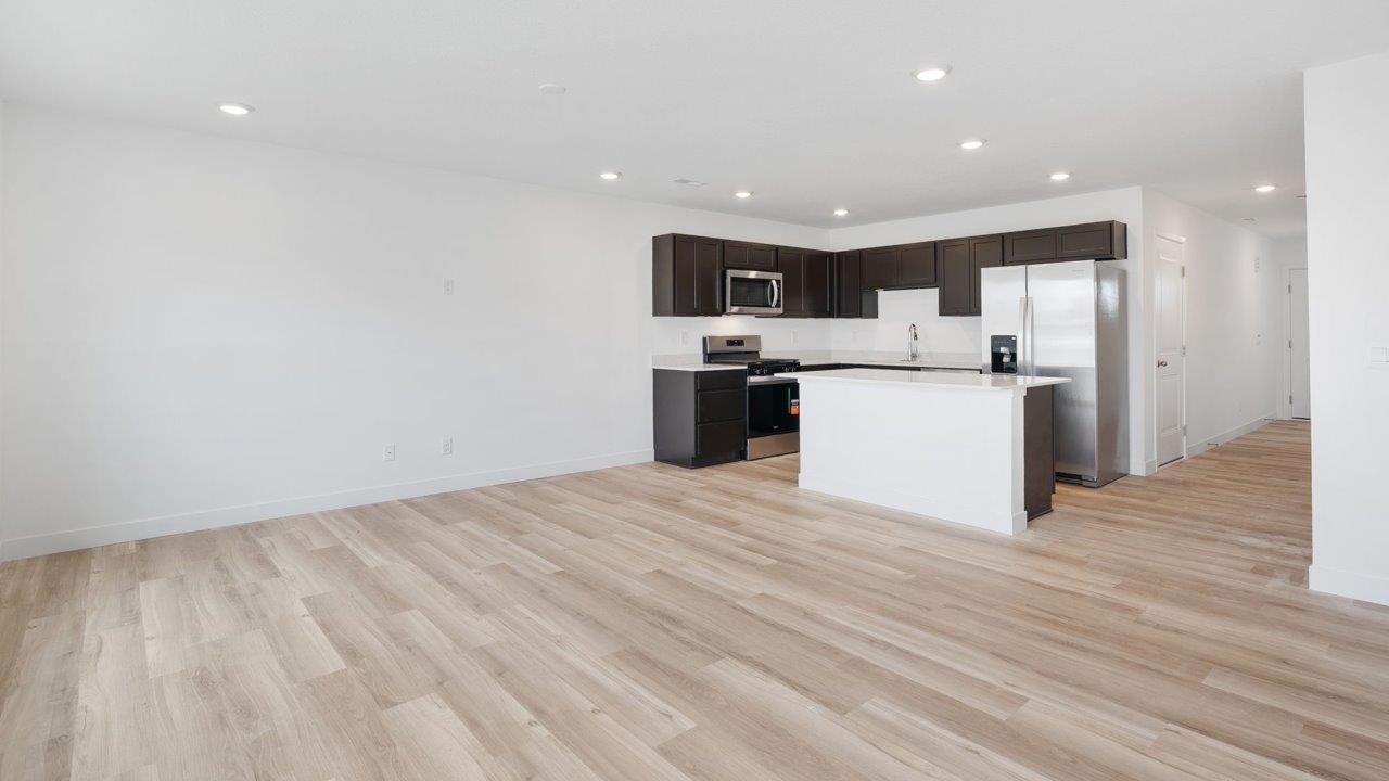 whispering pines pearson - open layout living room with mohawk lvp flooring