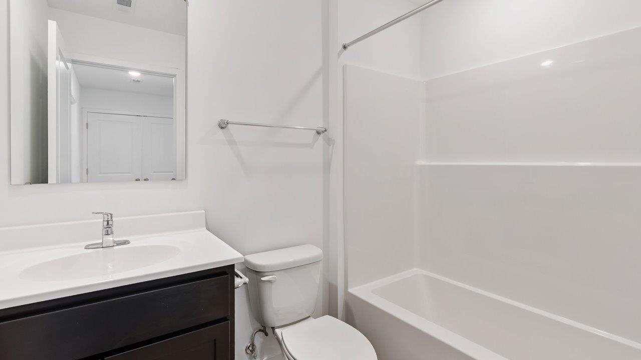 whispering pines pearson - full bathroom with single sink vanity and tub shower