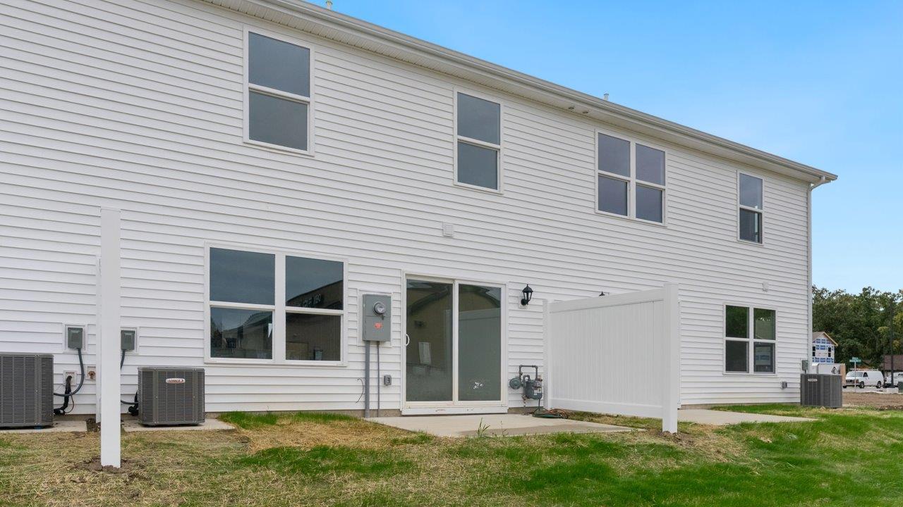 whispering pines pearson rear exterior with concrete patio