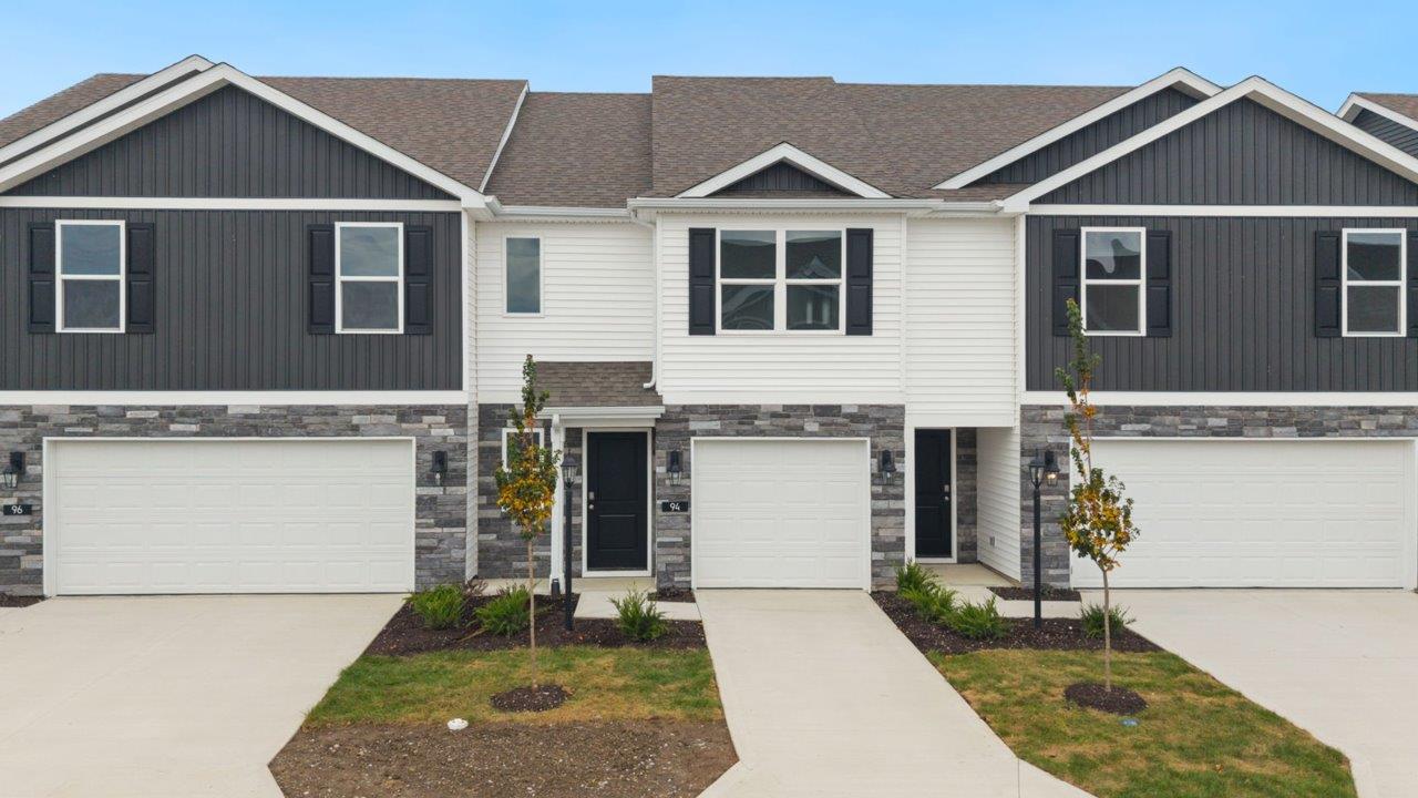 whispering pines pearson exterior with single car garage, sodded yard, and landscaping