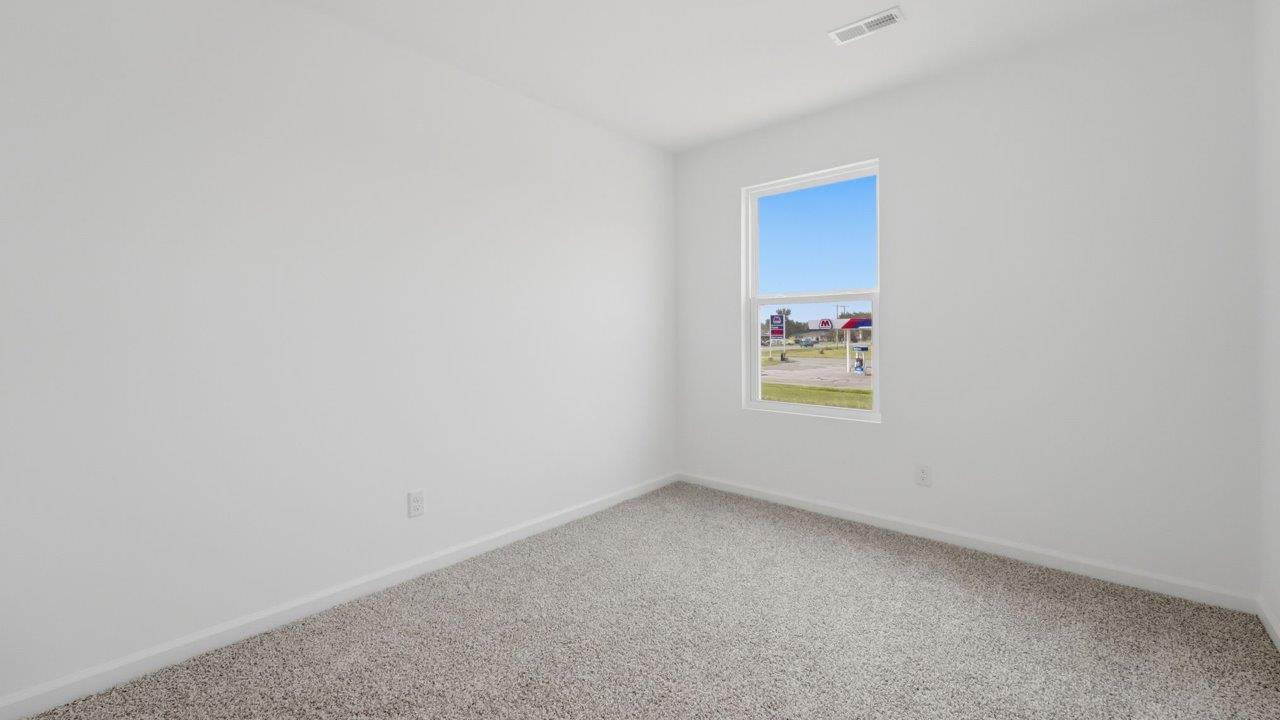 whispering pines pearson bedroom 2 with 1 window, beige carpet, and closet