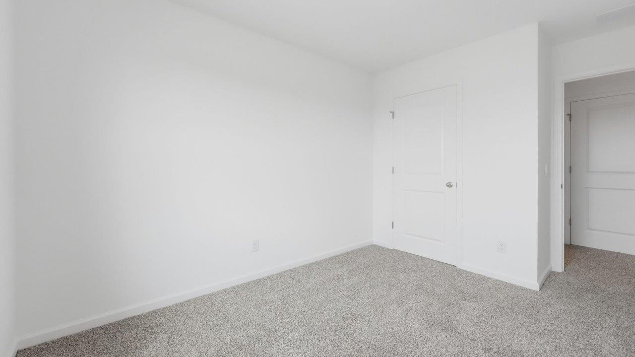 whispering pines pearson bedroom 2 with 1 window, beige carpet, and closet