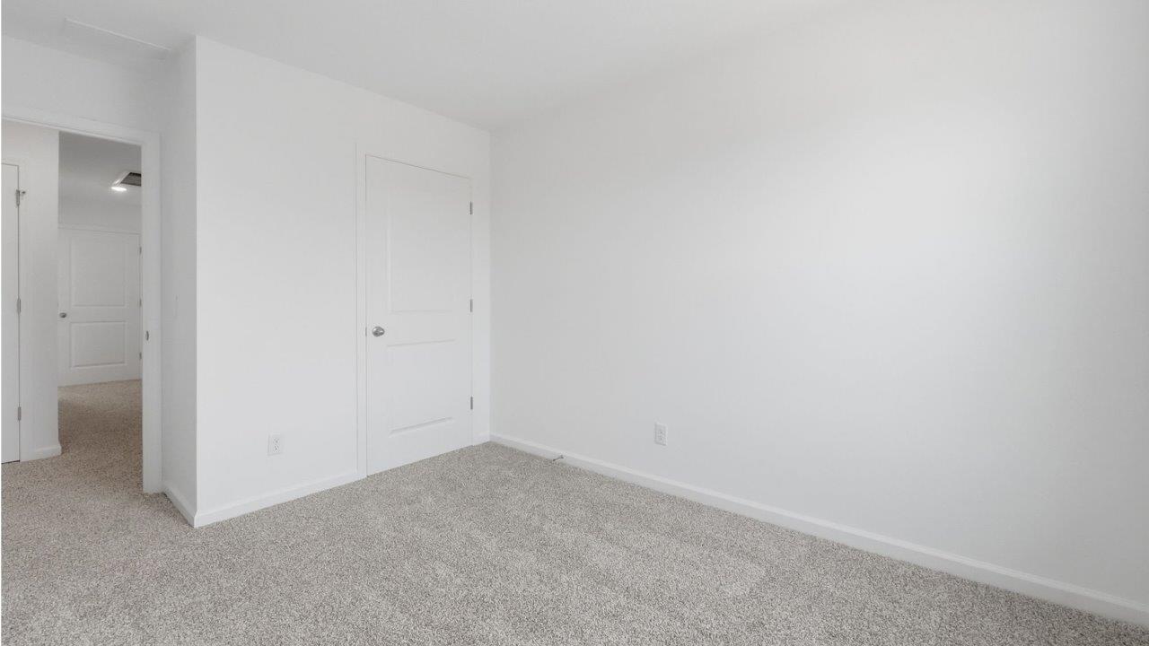 whispering pines pearson bedroom 2 with 1 window, beige carpet, and closet