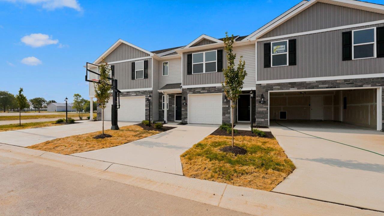 whispering pines pearson townhome exterior with 1 car garage