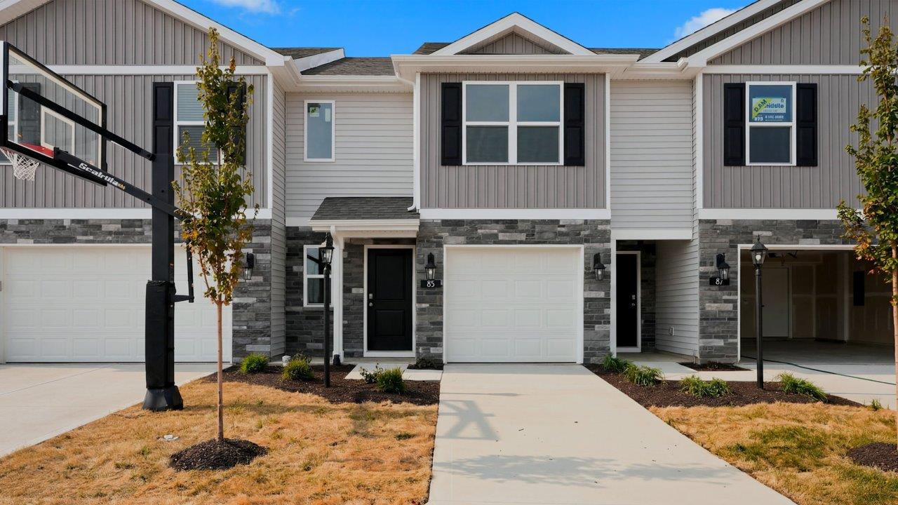 whispering pines pearson townhome exterior with 1 car garage
