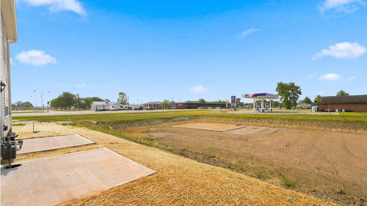 whispering pines pearson townhome exterior with backyard concrete patio