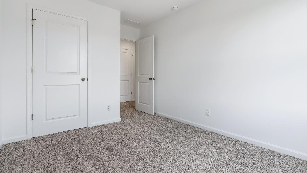 bedroom 3 with carpet flooring