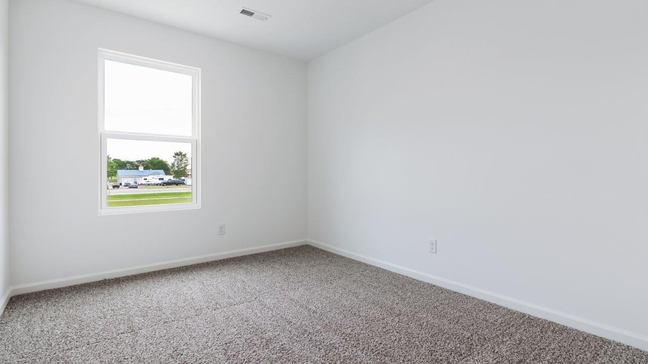 bedroom 3 with carpet flooring