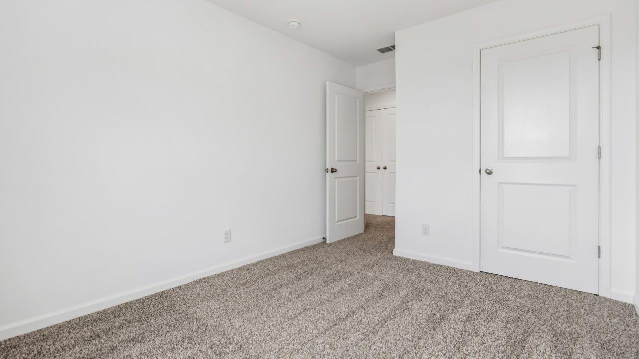 bedroom 2 with carpet flooring