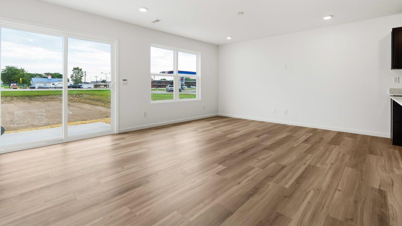casual dining room with lvp flooring and sliding glass door