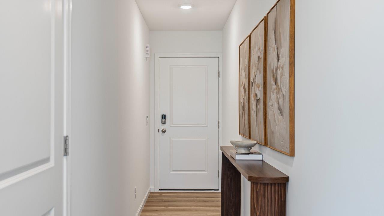 whispering pines pattison plan interior model home - foyer and front door