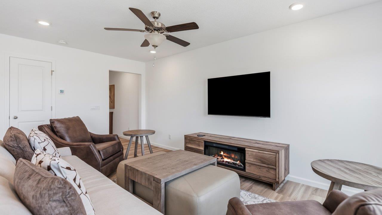 whispering pines pattison plan interior model home - open layout living room