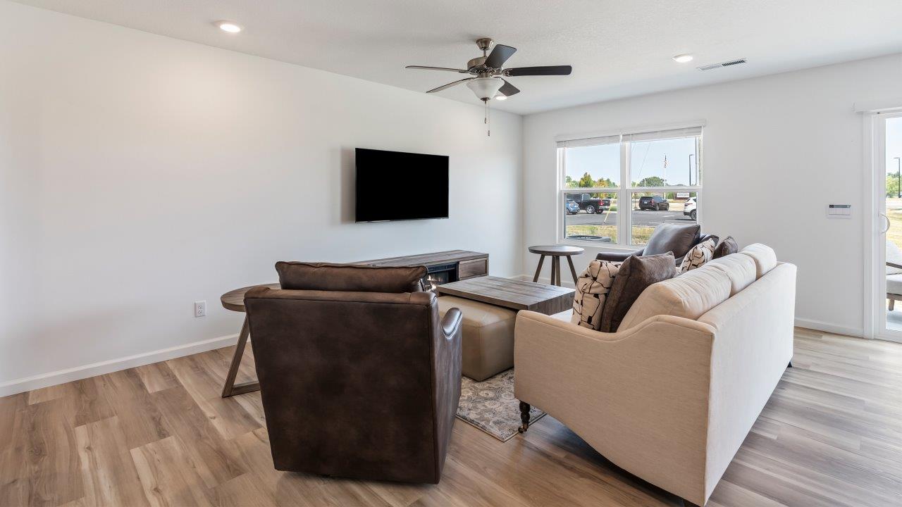 whispering pines pattison plan interior model home - open layout living room